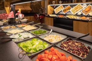 a buffet line with many different types of food at Der Rindererhof in Tux