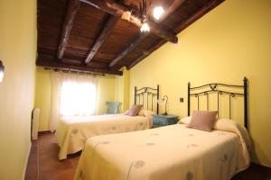 Säng eller sängar i ett rum på Casa Rural Las Huertas de Buendia