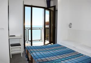 מיטה או מיטות בחדר ב-Hotel Ondina