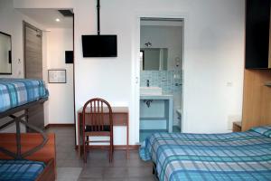 Postel nebo postele na pokoji v ubytování Hotel Ondina