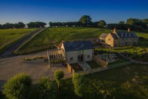 an aerial view of a large house in a field at Goose Run Cottage in Corscombe