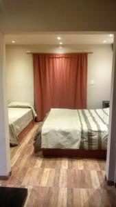 Ένα ή περισσότερα κρεβάτια σε δωμάτιο στο CASA 2