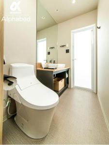 a bathroom with a toilet and a sink at ALPHABED INN Fukuoka Ohori Park / Vacation STAY 65802 in Fukuoka