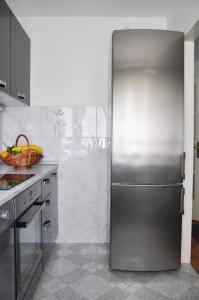 Kuchyň nebo kuchyňský kout v ubytování Apartment Center