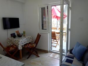 TV a/nebo společenská místnost v ubytování Apartman Leo + 2 fotografie