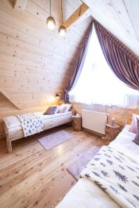 Легло или легла в стая в Przystań w Tatrach - Przytulne Domki i Apartamenty-Luxury Chalets and Apartments