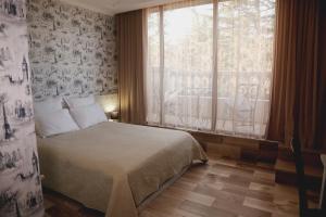 Postel nebo postele na pokoji v ubytování Hotel King David The Builder + 37 fotografií