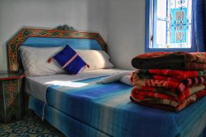 Ένα ή περισσότερα κρεβάτια σε δωμάτιο στο Hotel Ouarzazate