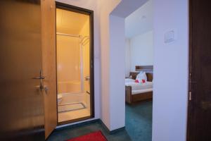 Un pat sau paturi într-o cameră la Hotel Vanda