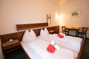 Un pat sau paturi într-o cameră la Hotel Vanda