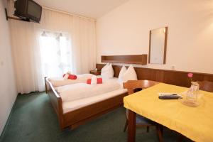 Un pat sau paturi într-o cameră la Hotel Vanda