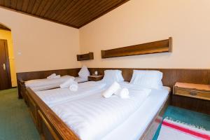 Un pat sau paturi într-o cameră la Hotel Vanda