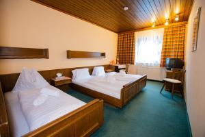 Un pat sau paturi într-o cameră la Hotel Vanda