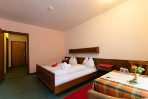 Un pat sau paturi într-o cameră la Hotel Vanda
