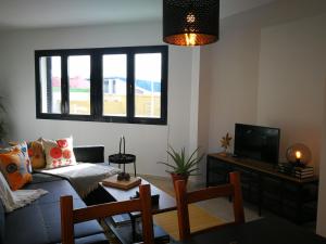 TV a/nebo společenská místnost v ubytování Apartamento playa de Levante