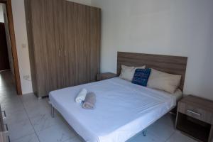 Postel nebo postele na pokoji v ubytování Seafront Room