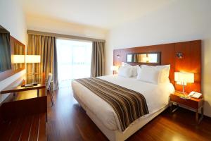 Cama o camas de una habitación en Legendary Lisboa Suites