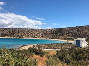 a small shack on the shore of a beach at Kritamos suites in Irakleia