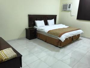 Katil atau katil-katil dalam bilik di Etlalet Al-Sharm Apartments