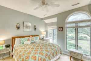 a bedroom with a bed and a window at 4522 Parkside Villa in Kiawah Island