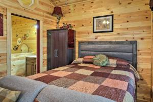 A bed or beds in a room at Cozy Heber Springs Cabin with Deck and Dock!