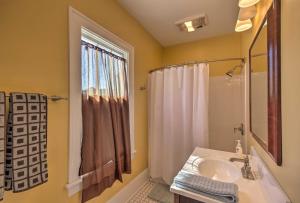 a bathroom with a sink and a shower at Historic Home 8 Mi to Bristol Motor Speedway in Bristol +16 photos
