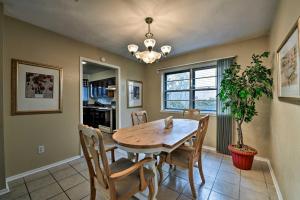 a dining room with a table and chairs and a potted plant at Pet-Friendly Missouri City Home with Fenced-In Yard! in Missouri City