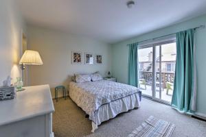 a bedroom with a bed and a sliding glass door at Family-Friendly Wildwood Townhome about 3 Mi to Beach in Wildwood