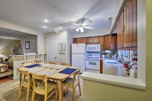 a kitchen and dining room with a table and chairs at Family-Friendly Wildwood Townhome about 3 Mi to Beach in Wildwood