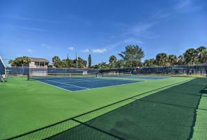 a tennis court with two tennis courts at Cozy Indian Rocks Beach Condo - Steps to Beach! in Clearwater Beach