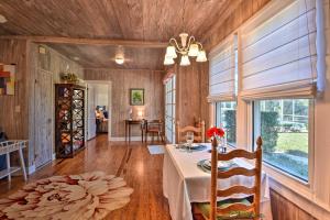 a dining room with wooden walls and a table and chairs at Cottage with Private Pool - Walk to Lake Wales! in Lake Wales