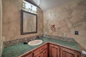 a bathroom with a sink and a mirror at Cozy Home with Mountain Views Near Ouray Hot Springs in Ouray