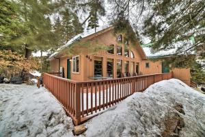 a house with a large deck in the snow at Cozy Home with Mountain Views Near Ouray Hot Springs in Ouray