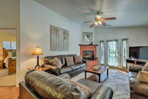 a living room with a couch and a fireplace at Patio and Mtn Views Tranquil Sedona Gem in Sedona