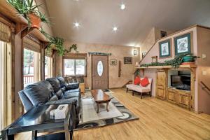 a living room with a couch and a table at Cozy Home with Mountain Views Near Ouray Hot Springs in Ouray +16 photos