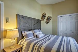 A bed or beds in a room at Lincoln Condo with Mtn Views, 2 Miles to Ski Resort!