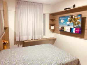 Tempat tidur dalam kamar di Apartamento Beira Mar Maceió