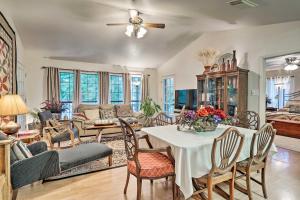 a living room with a table and chairs at Riverfront Martindale House with 2 Covered Decks in Martindale