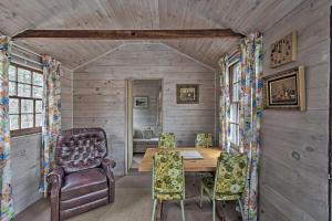 a dining room with a wooden table and chairs at Cozy Vineyard Haven Cottage Less Than 1 Mi to Beach! in Vineyard Haven