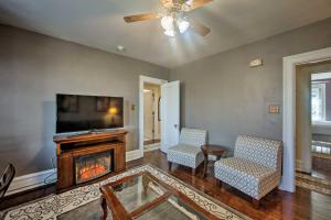 a living room with a fireplace and a tv at Cozy Reading Retreat with Comm Patio by The Pagoda! in Reading