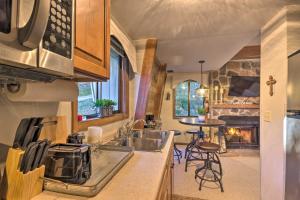 a kitchen with a sink and a stove top oven at Rustic Banner Elk Getaway about 1 Mi to Sugar Mountain in Banner Elk