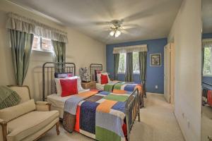 ein Schlafzimmer mit 2 Betten, einem Sofa und einem Ventilator in der Unterkunft El Cajon Home with Pool, Grill Station and Decks in El Cajon + 26 Fotos