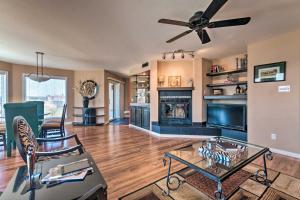a living room with a couch and a ceiling fan at Balcony, Pool and Hot Tub Cozy Condo in Arkansas! in Lake Hamilton