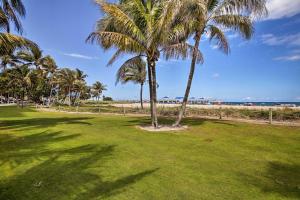 a group of palm trees on the beach at Hip Studio with Patio 1 Mi to Pompano Beach Pier in Pompano Beach