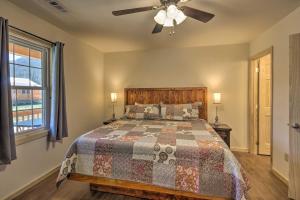 A bed or beds in a room at Cozy Bryson City Cabin about 6 Mi to Harrahs Casino!