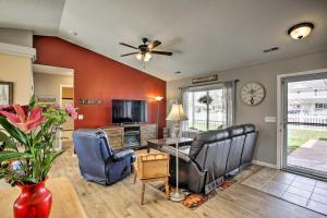 a living room with two chairs and a table at Cozy Getaway with Yard and Patio 4 Mi to Hayden Lake! in Hayden