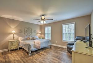 a bedroom with a bed and a ceiling fan at Dahlonega Home with Yard near Hiking and Downtown in Dahlonega