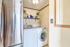 a kitchen with a refrigerator and a washing machine at Surfside Beach Home with Resort Perks Walk to Beach in Myrtle Beach