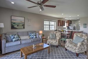 a living room with a couch and a table at Walk-In Condo on Golf Course with Pool Walk to Strip in Branson
