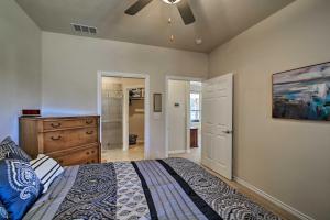 a bedroom with a bed and a ceiling fan at Hill Country Casita with Patio 13 Mi to Dtwn Boerne in Kreutzberg